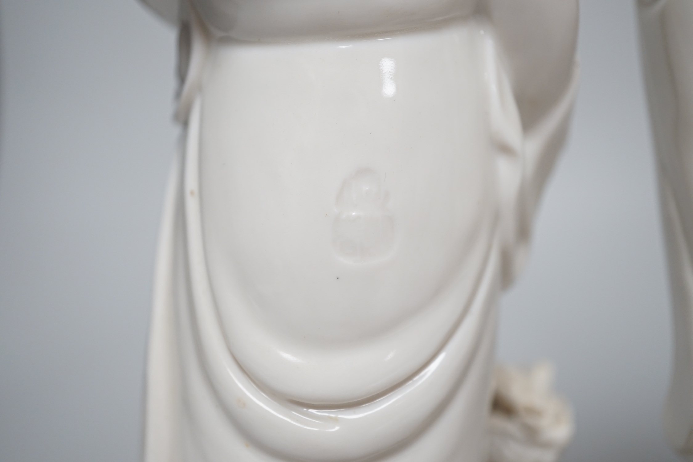 Three Chinese blanc de chine figures of Guanyin, 25cm